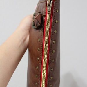 Brown Distressed knee high boots.